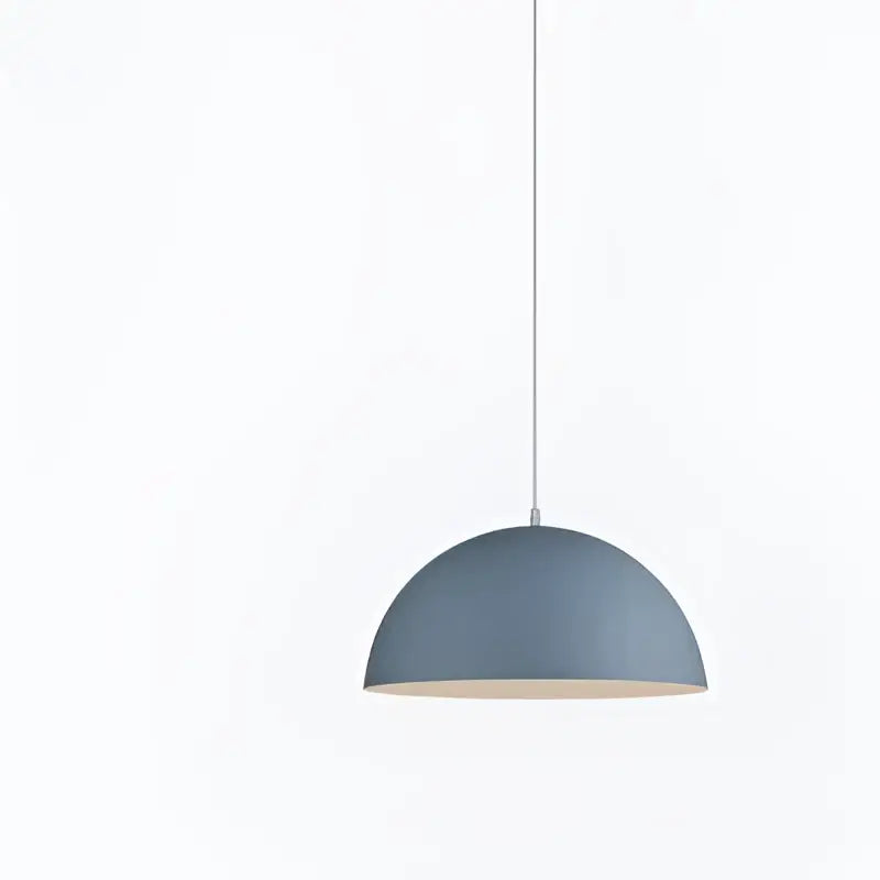 A sleek matte blue dome iron lustre pendant light with white cord for modern kitchen bar decorbites pendant lights