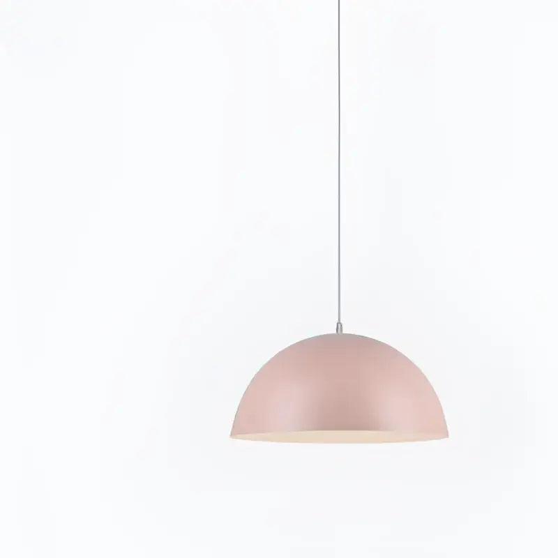 Soft pink dome-shaped iron lustre pendant light with matte finish hanging from white cord by decorbites for kitchen bar decor