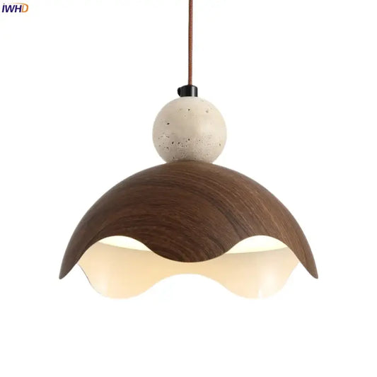 Modern pendant light with dark wood petal shade and speckled beige concrete sphere from decorbites iron yellow travertine