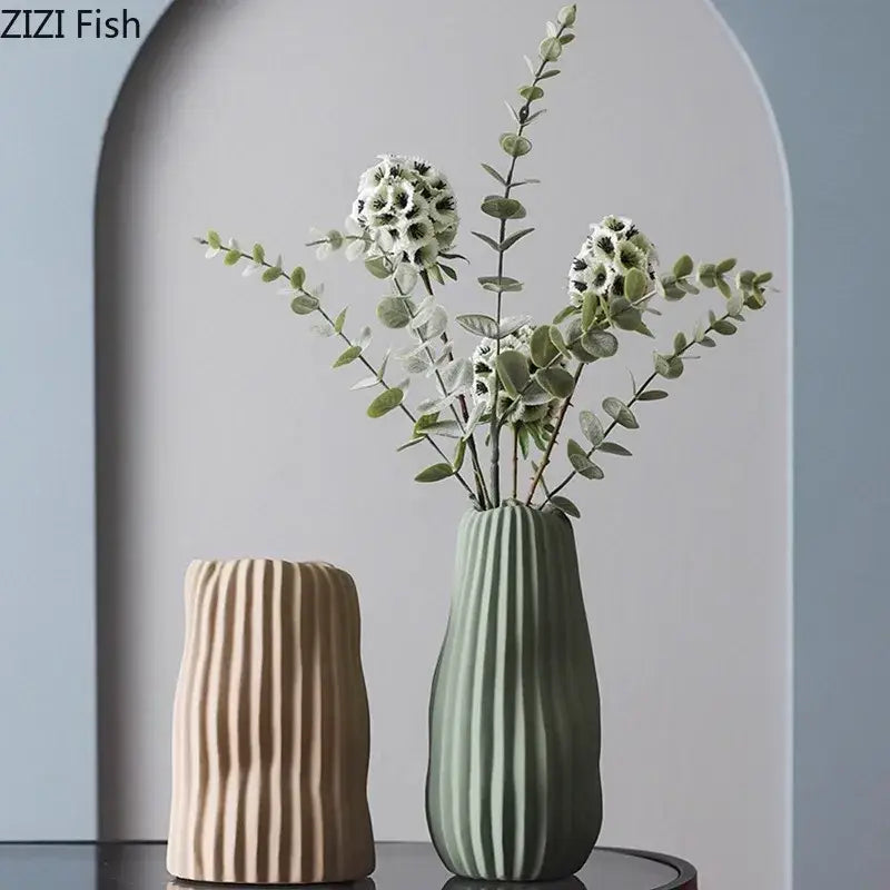 A sleek sage green irregular ceramic vase with ribbed texture from decorbites irregular ceramic vase trio decor