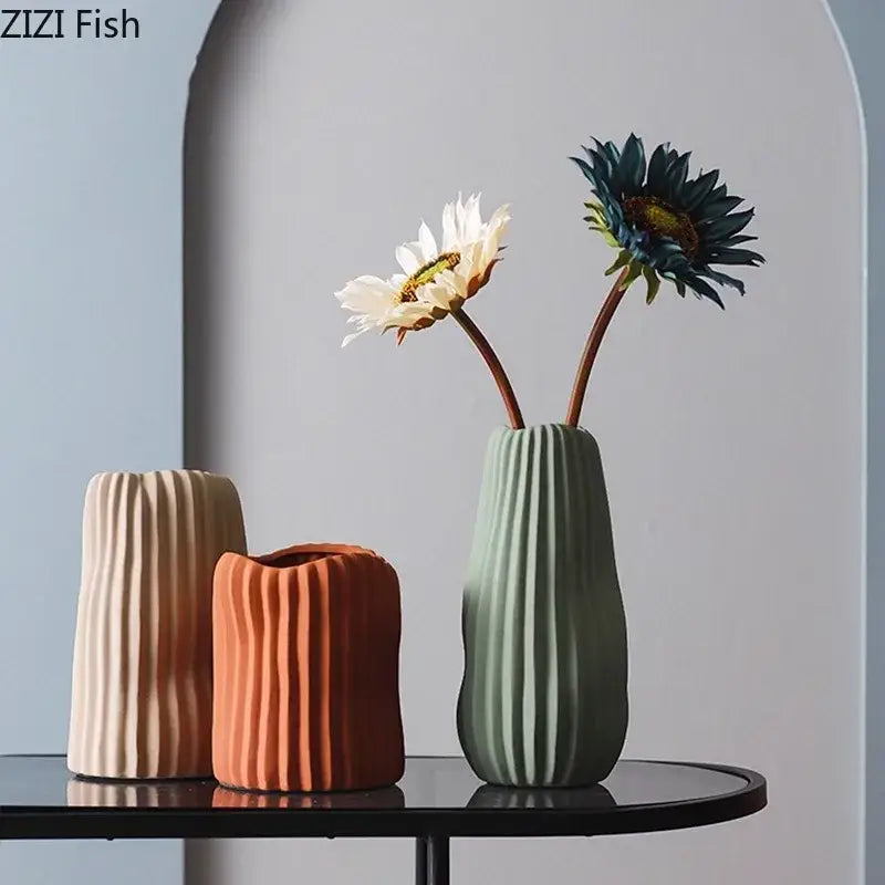 Modern irregular ceramic vase trio in beige terracotta and sage green with vertical ribbed texture by decorbites irregular ceramic