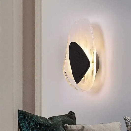 Modern irregular graphic wall light featuring a frosted glass disc and sleek black triangular accent for bedroom decorbites irregular graphic wall