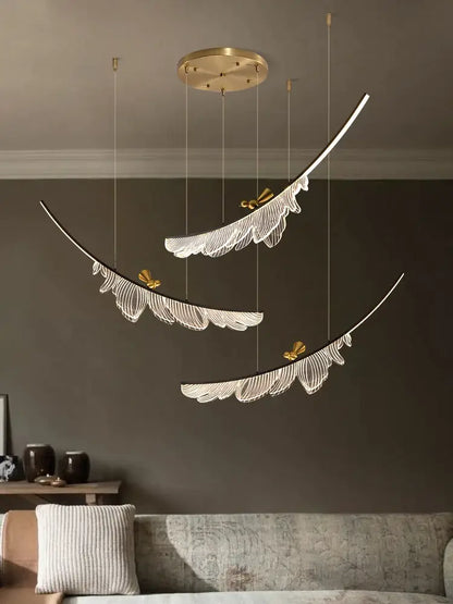Modern italian copper chandelier featuring gold-toned feather pendant lights with white filigree and butterfly accents decorbites italian copper