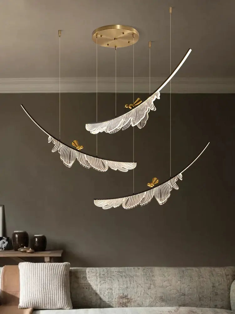 Modern italian copper chandelier featuring gold-toned feather pendant lights with white filigree and butterfly accents decorbites italian copper