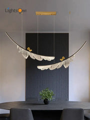 Modern italian copper chandelier gold bird pendant light with gold-toned feather design and intricate white detailing by decorbites italian copper