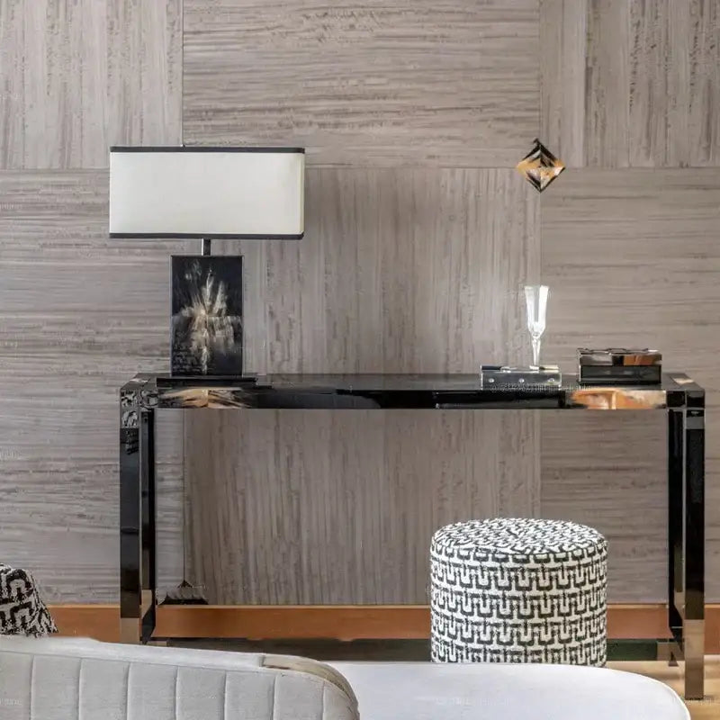 Black mirrored console table with sleek chrome legs and glossy finish complementing decorbites italian luxury table lamps