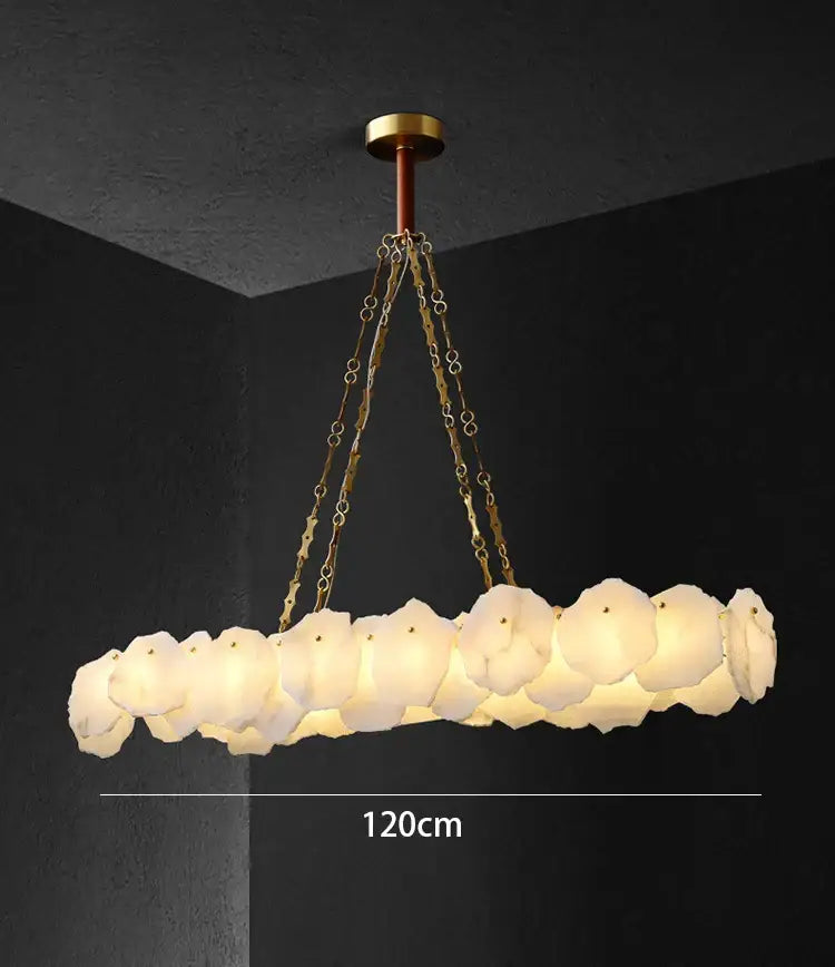 Modern ivory white marble ceiling light with circular brass chains and frosted glass petals for decorbites ivory white decor