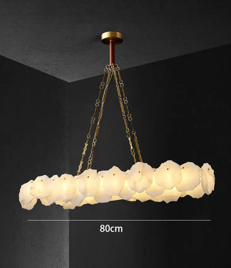 Modern ivory white marble led ceiling light with a circular brass fixture and frosted petal glass shades decorbites ivory white