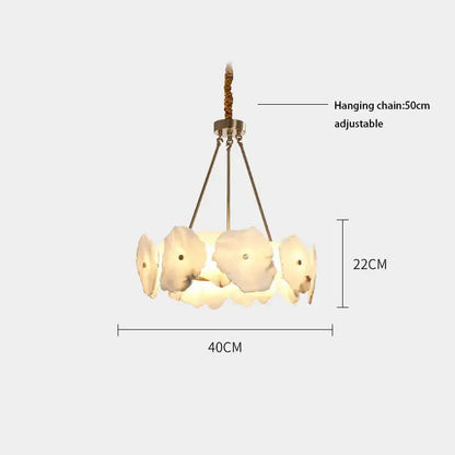 A modern ceiling light with five off-white petal-shaped glass shades brass arms and braided rope chain for decorbites ivory white marble decor