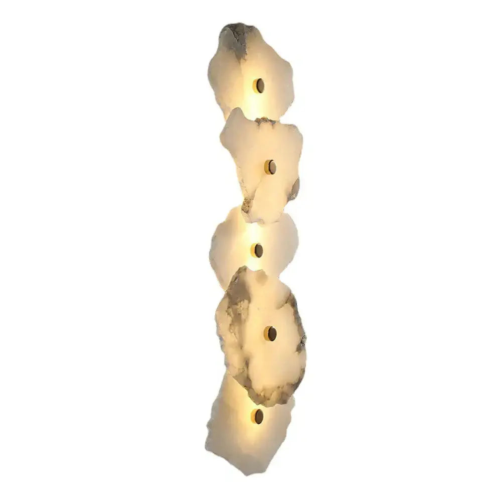 Modern ivory white marble ceiling light with five stacked irregular stone discs and embedded LED decorbites ivory white