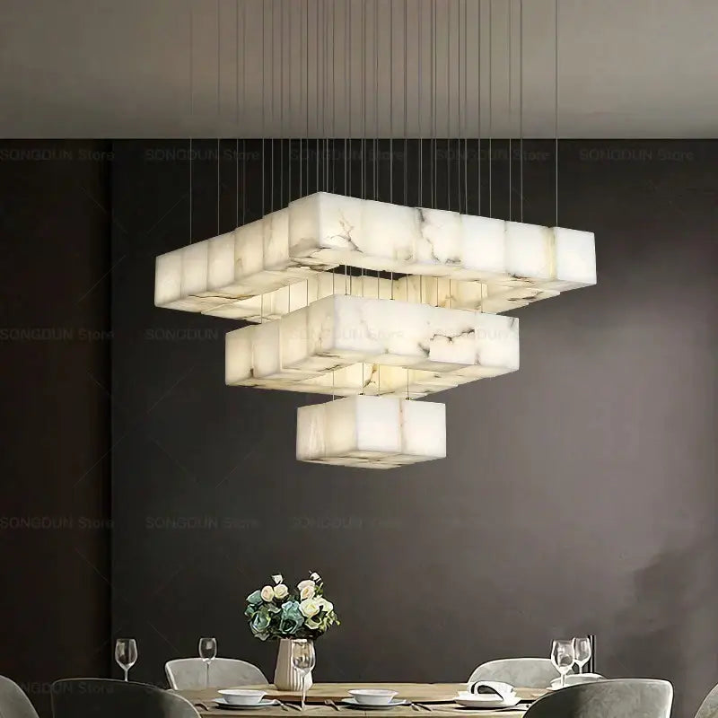 Modern jade design spiral alabaster chandelier featuring white marble tiered pendant lights suspended by thin cables for living room decorbites jade design