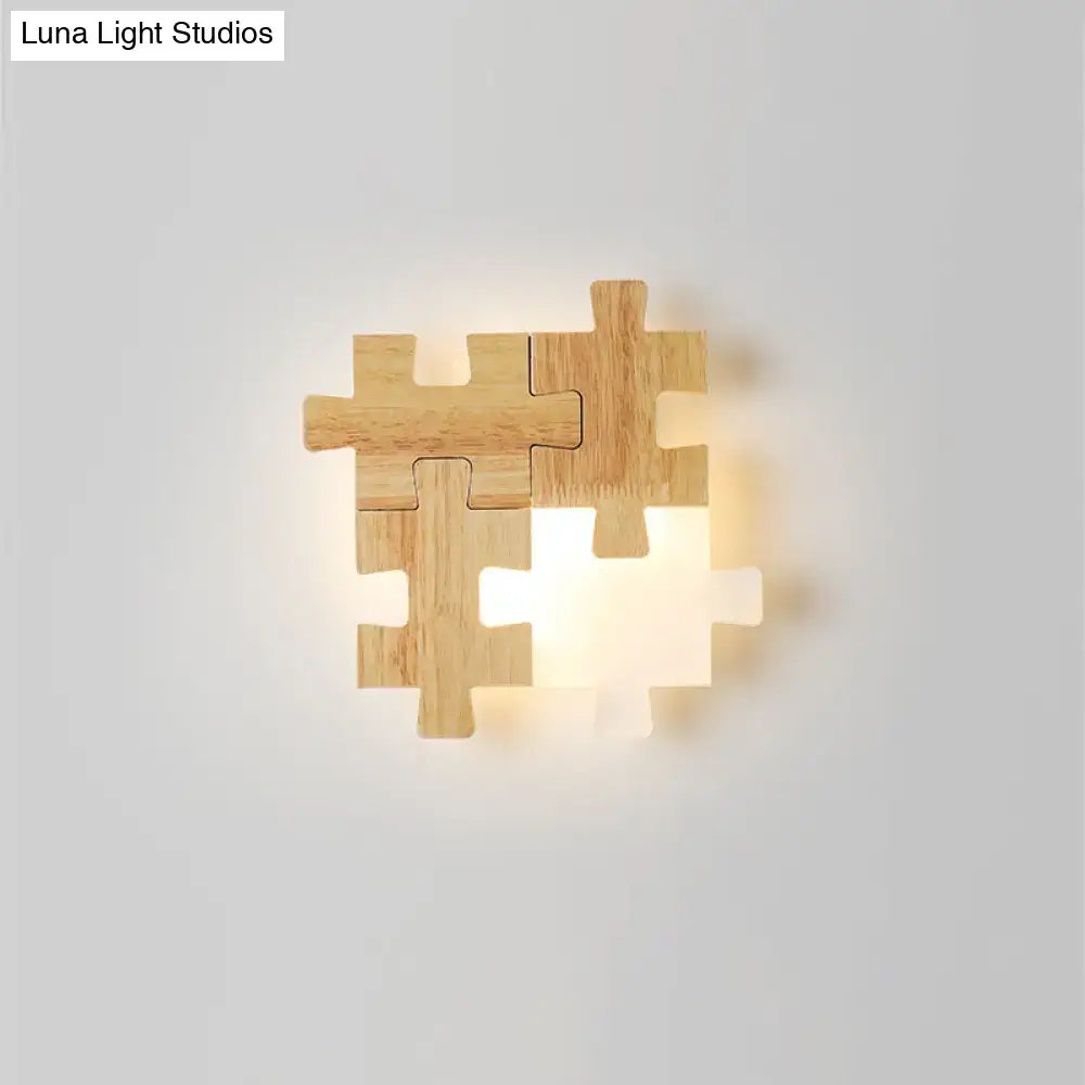 Modern jigsaw wood wall lamp featuring warm led lighting and a light-colored wooden puzzle piece sconce light