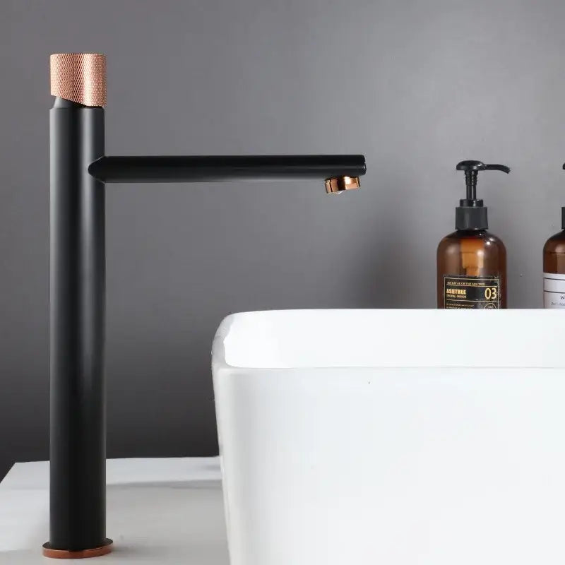 Modern knurled brushed gold basin faucet with black matte finish and rose gold accents by decorbites brushed gold