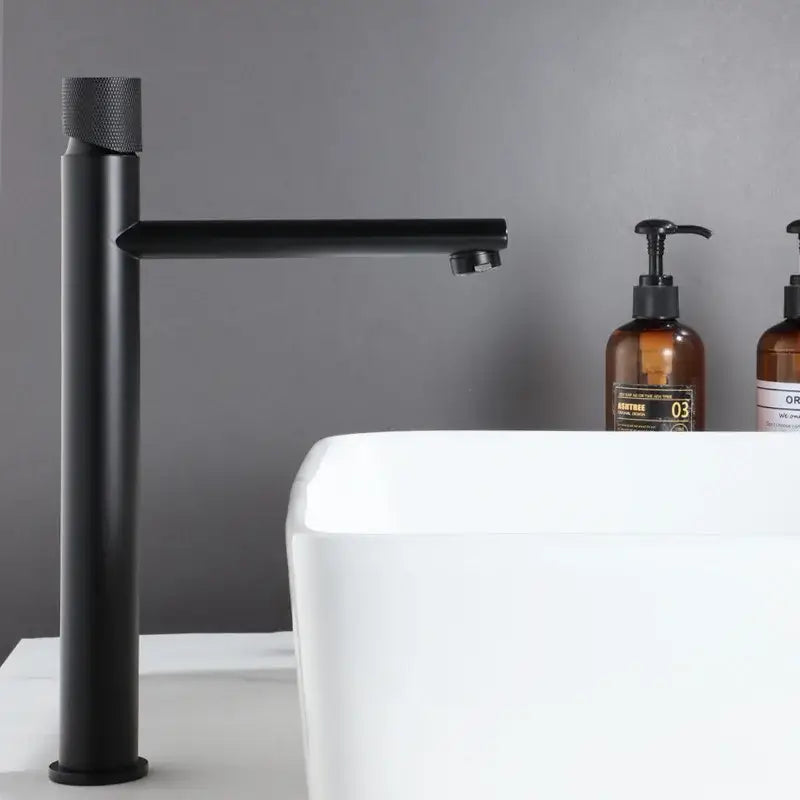Black matte modern basin faucet with textured cylindrical handle and minimalist design decorbites brushed gold style