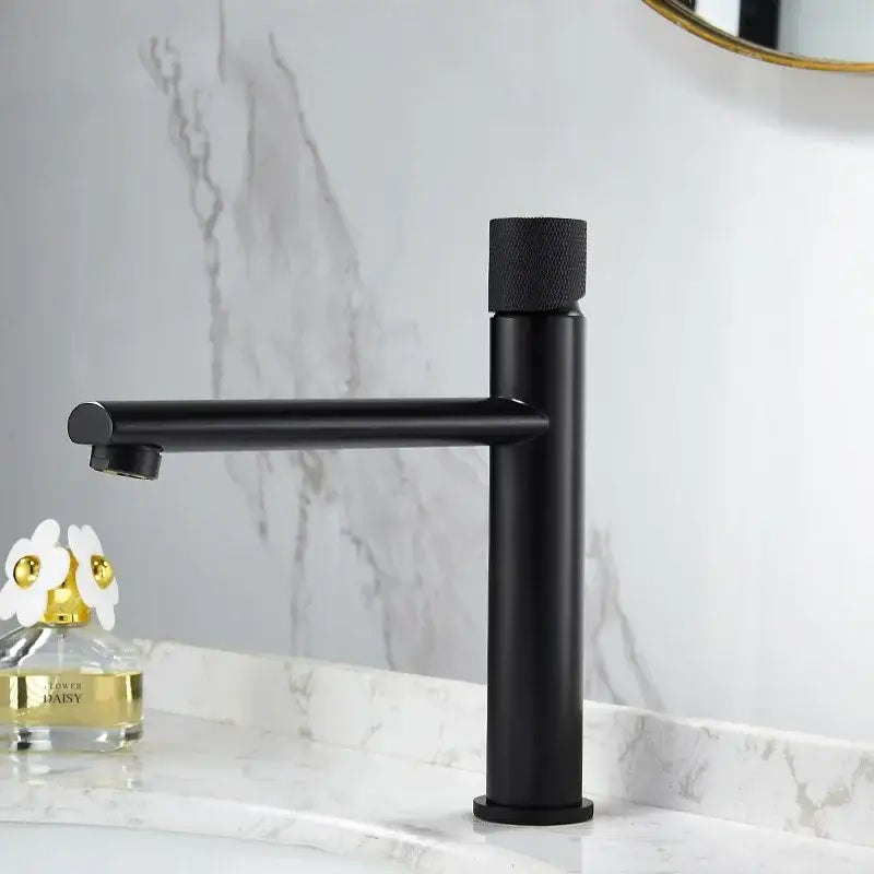 Modern knurled brushed gold basin faucet with black matte finish single-handle and textured cylindrical knob decorbites brushed gold