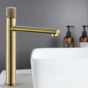 Modern knurled brushed gold basin faucet with textured handle and sleek cylindrical spout for decorbites brushed gold decor