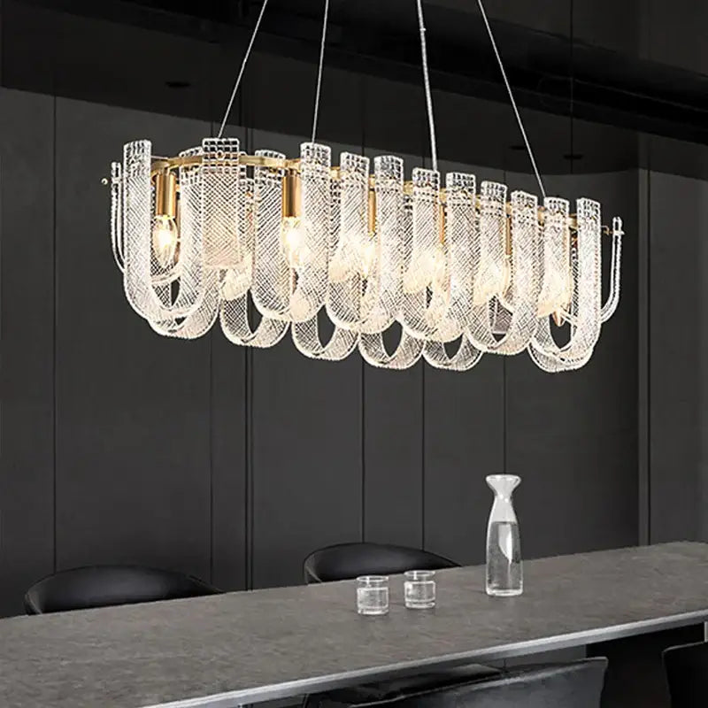 A modern rectangular ceiling chandelier with gold-toned frame and cascading clear crystal mesh shades for living room decorbites dimmable led