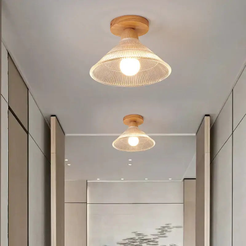 Modern leaf glass ceiling light with rattan pendant and natural wood base providing warm clear glass led glow