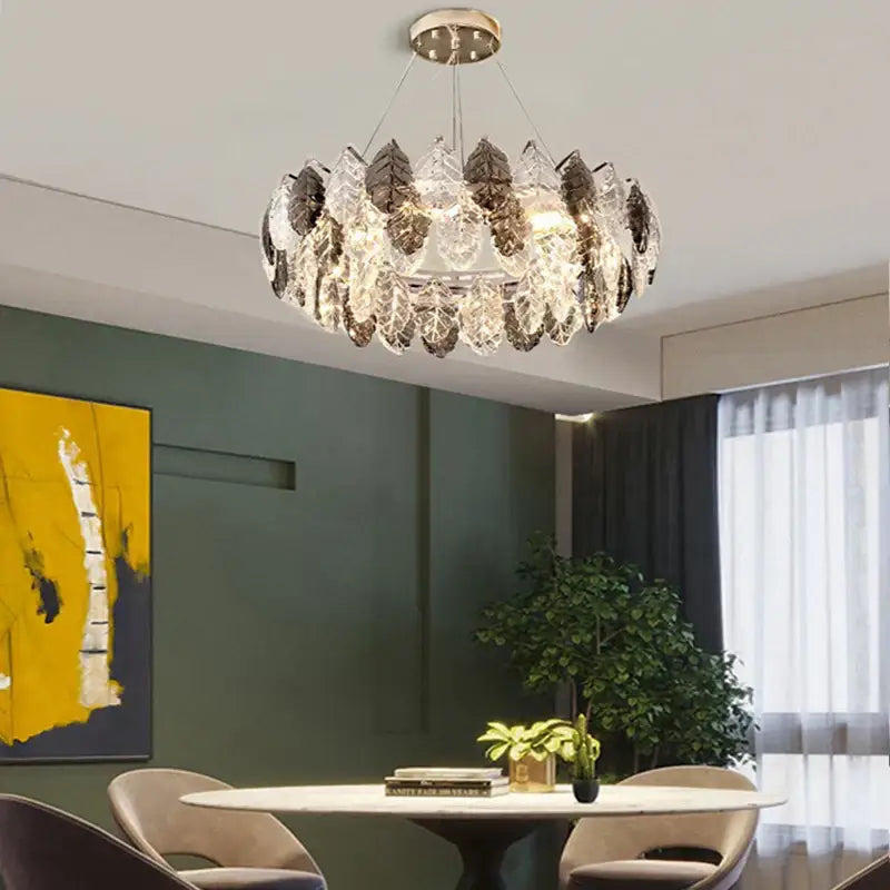 A modern pendant light with gold silver crystal leaf elements in a circular design for living room decorbites gold silver
