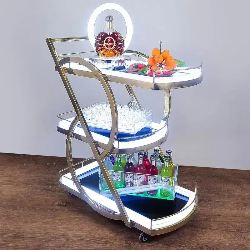 Modern chrome-finished beauty salon trolley with illuminated edges and tiered shelves for salon storage