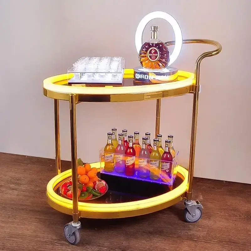 Gold-finished modern led beauty salon trolley with illuminated yellow led rings and casters for mobility and storage