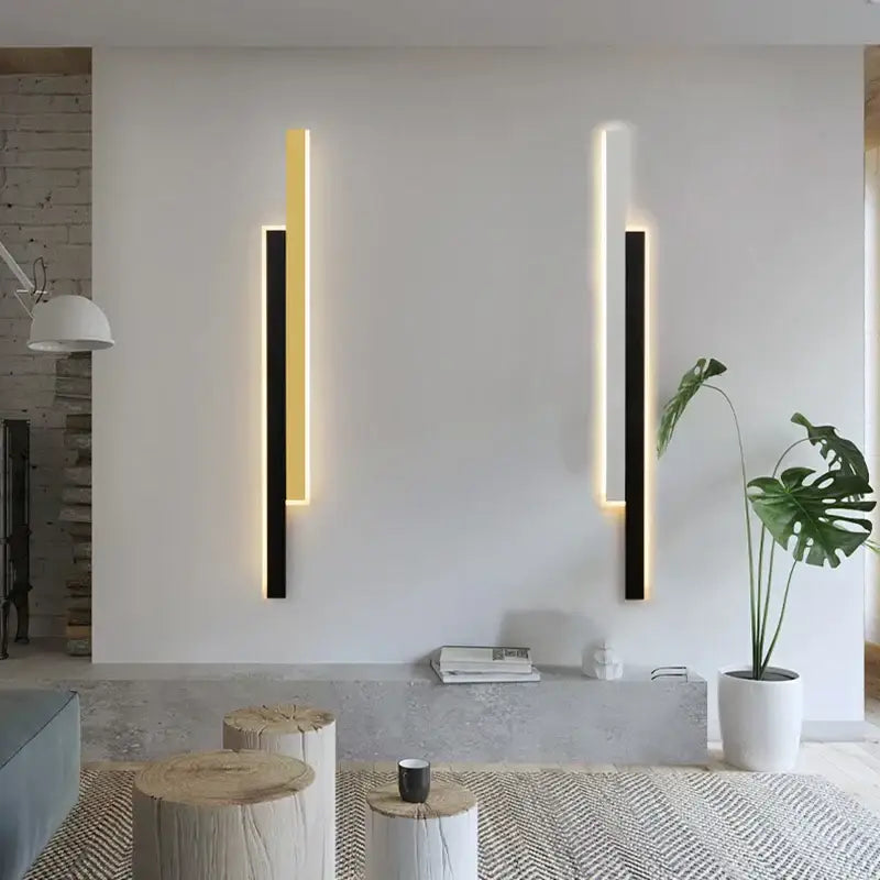 Two modern decorbites led black wall lamps with sleek vertical frames and glowing gold light strips for living room decor