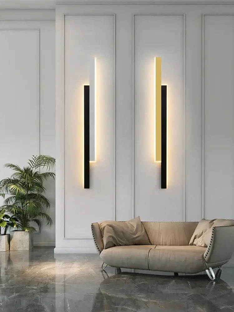 Two modern minimalist led black wall lamps with sleek vertical frames and warm gold glow for living room decorbites led black