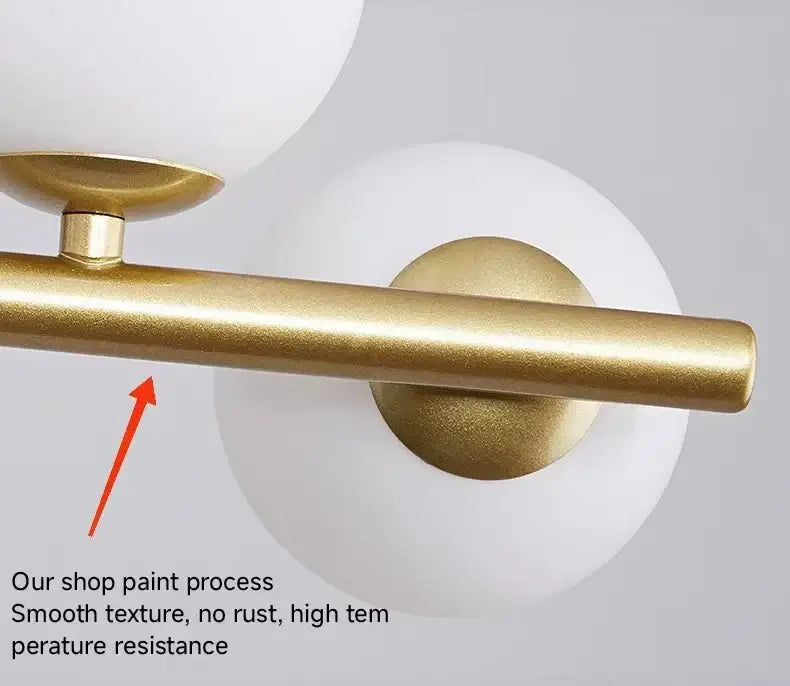 Gold-finished metal bar with smooth matte texture and rounded ends on a decorbites modern chandelier head ring