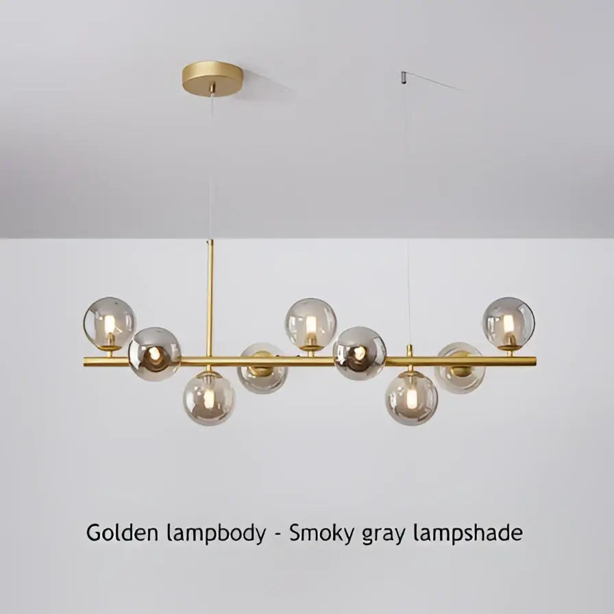 DecorBites 9-light modern chandelier with smoky gray glass globe shades and polished brass head ring frame
