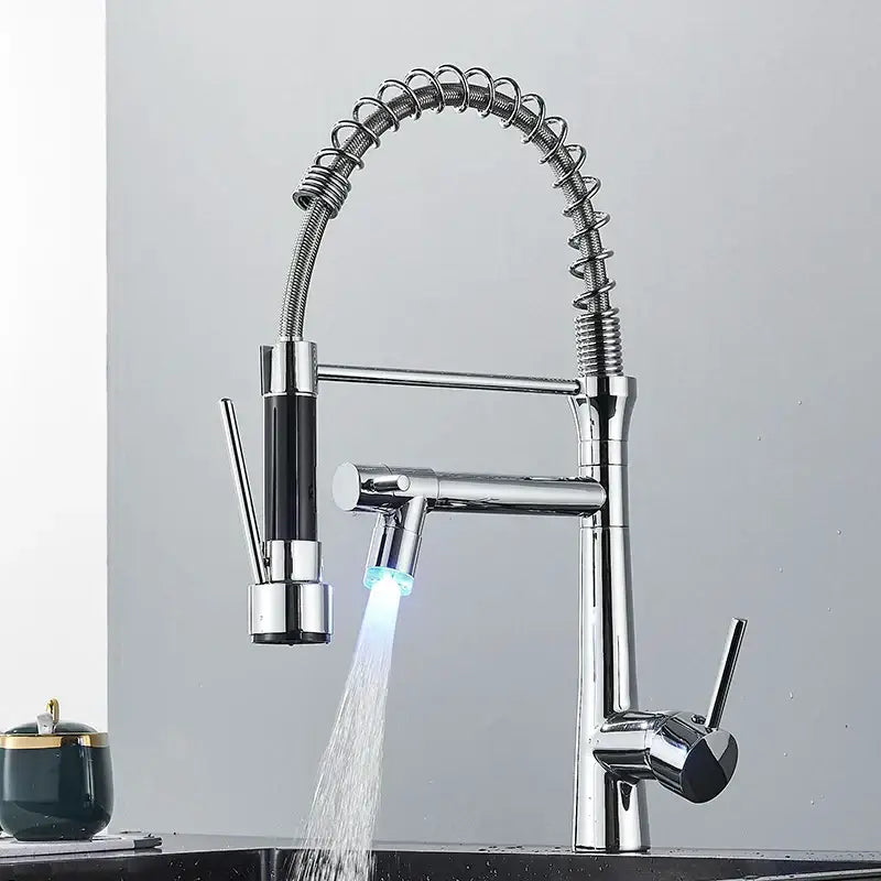 Modern led chrome dual nozzle kitchen faucet with spring design featuring a flexible coiled hose and dual spray heads decorbites dual nozzle