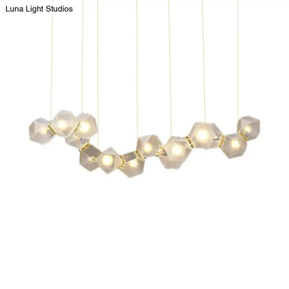 Modern geometric pendant ceiling light with white frosted glass hexagonal shades and gold connectors for dining room use