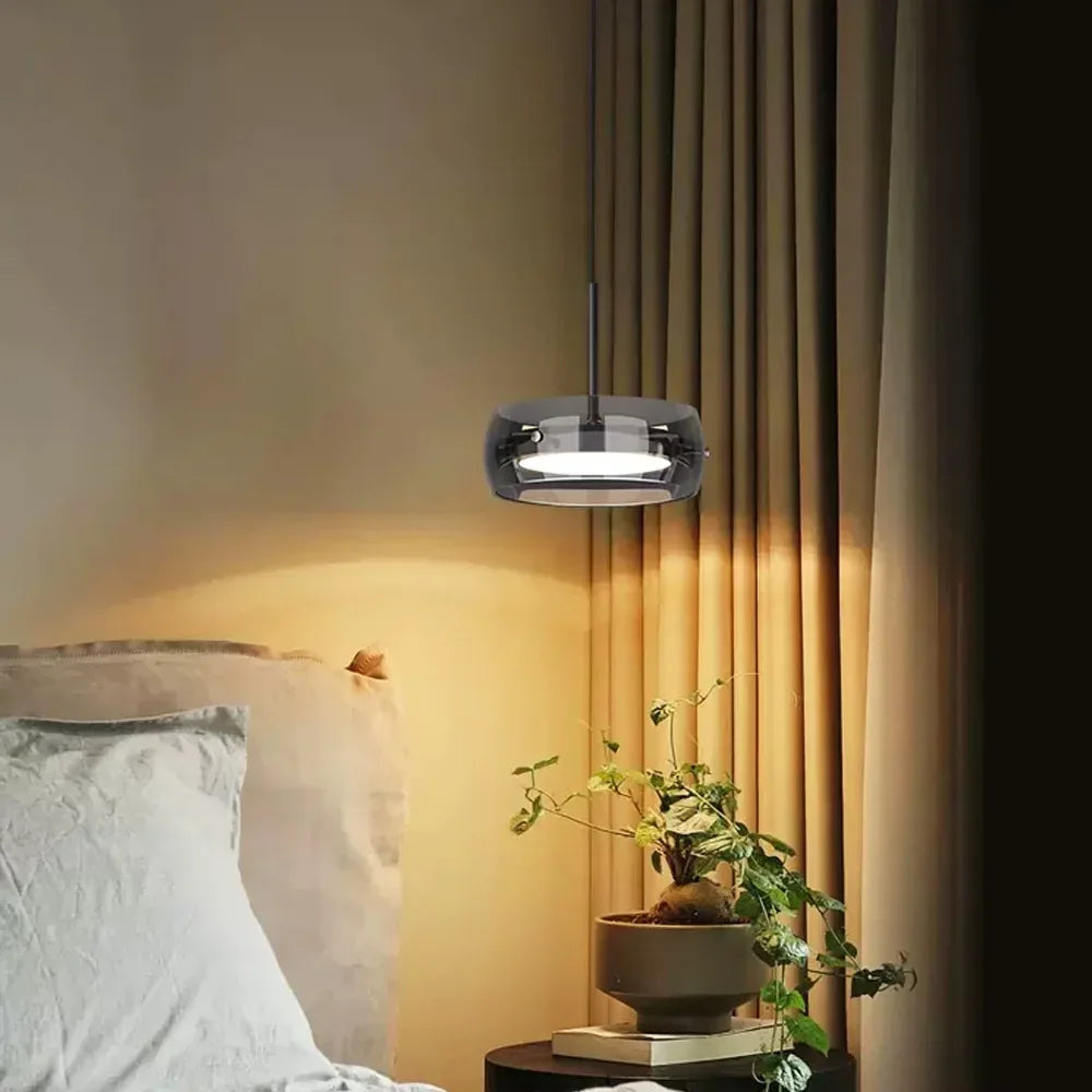 Modern black pendant lights with sleek circular glass shade plating for indoor warm decorative LED lighting