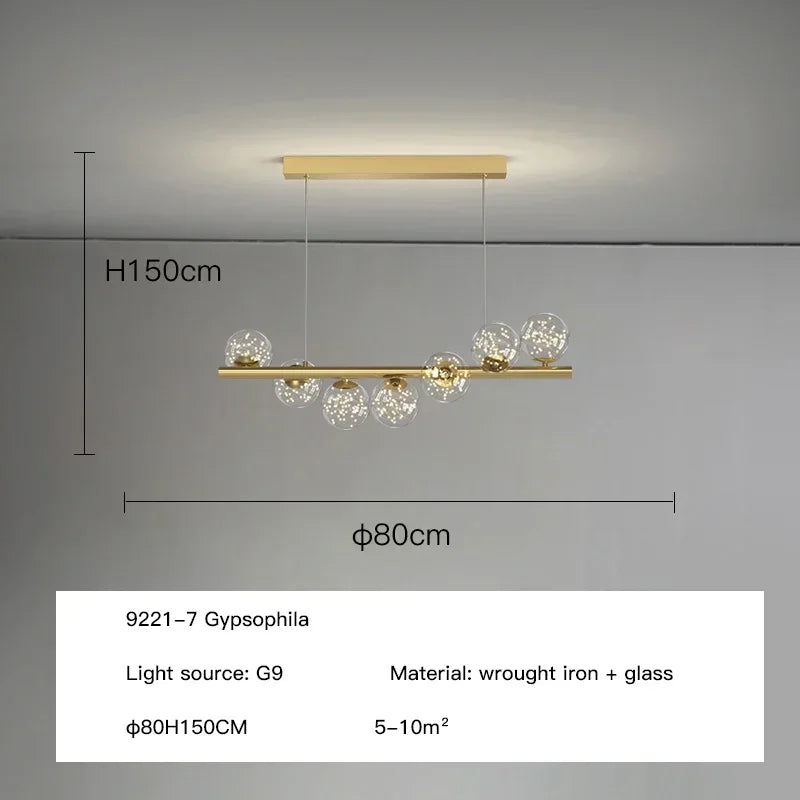 Modern led long ceiling chandelier with gold-toned wrought iron frame and clear glass globe bulbs for dining room lighting