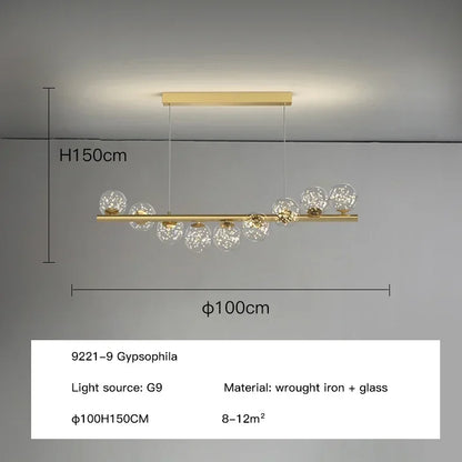 Gold-toned modern led ceiling chandelier with sleek wrought iron frame and clear glass globe shades for dining room