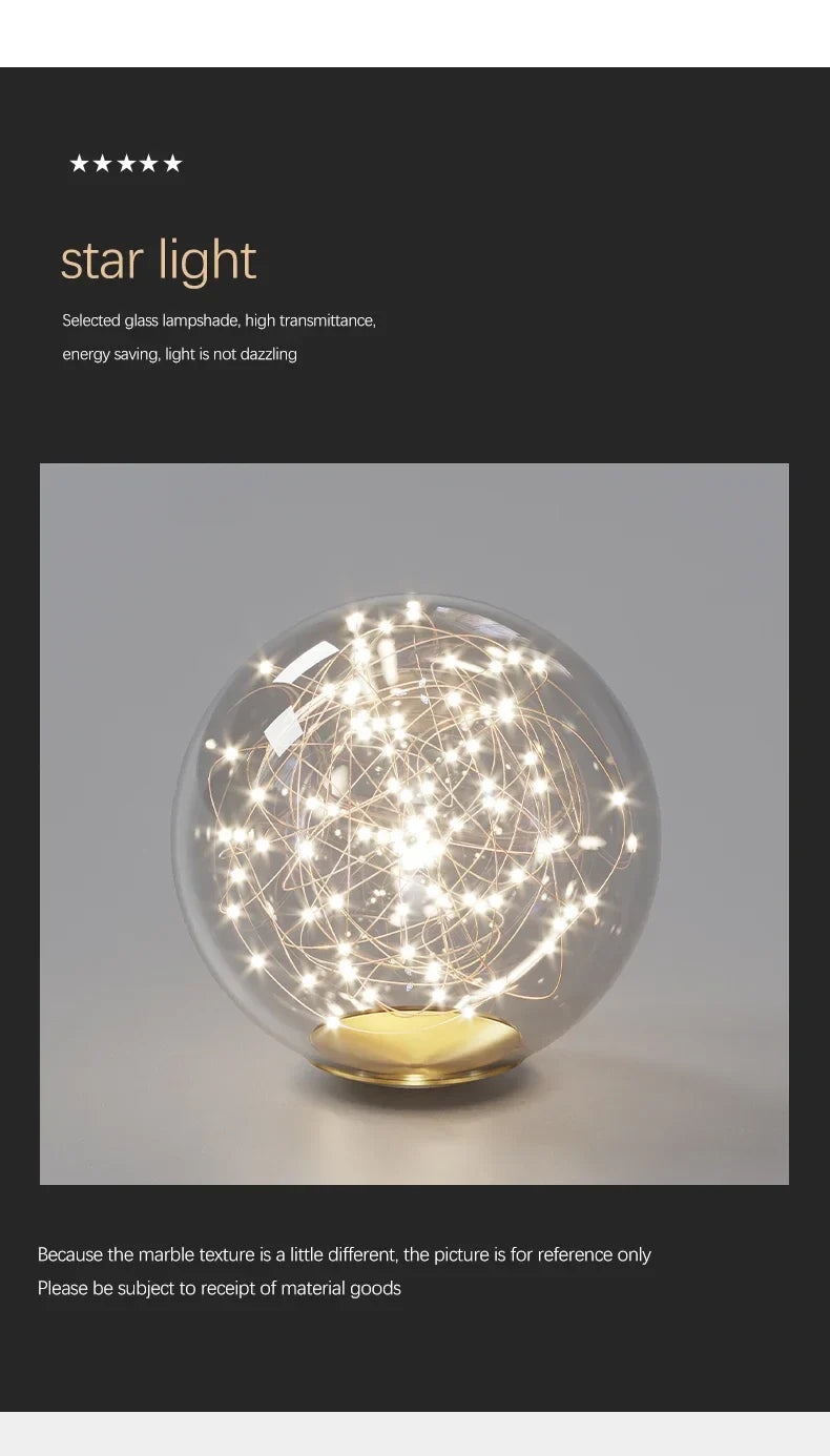 Modern led ceiling chandelier with clear glass spherical lamps and golden base illuminated by warm white led lights