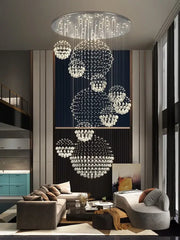 A modern led spiral crystal ball chandelier with cascading clear crystal spheres on a sleek metallic frame decorbites crystal ball