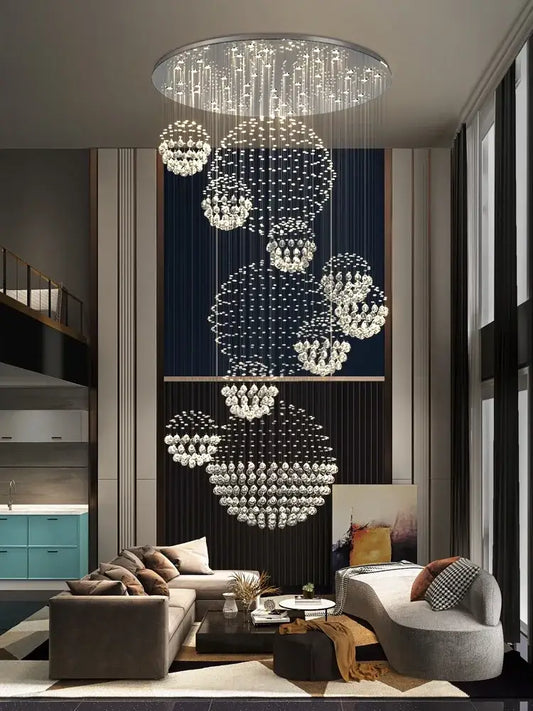 A modern led spiral crystal ball chandelier with cascading clear crystal spheres on a sleek metallic frame decorbites crystal ball