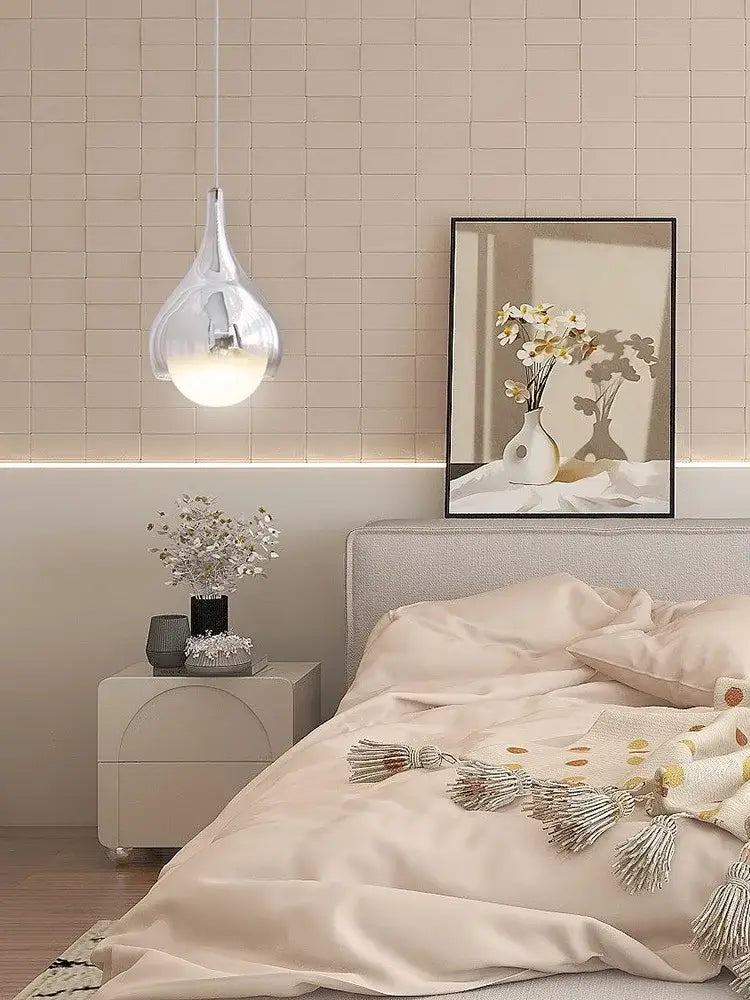 Modern led water droplet ceiling pendant light with clear glass body and warm glowing bulb for bedroom decorbites led water