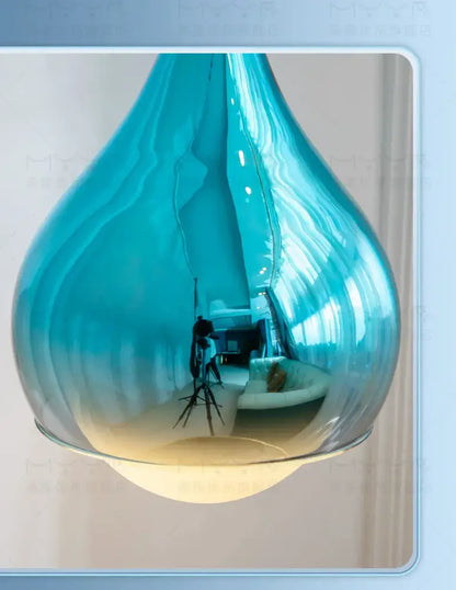 Modern led water droplet ceiling chandelier featuring a sleek translucent blue glass pendant light for bedroom decorbites led water