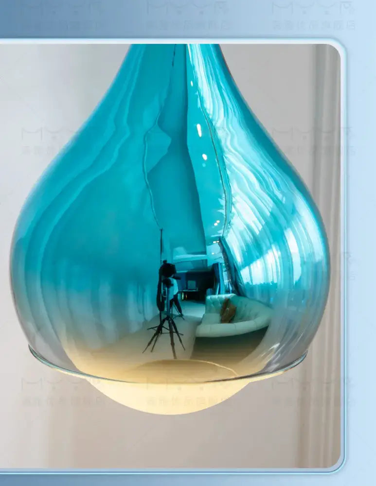 A sleek translucent blue glass led water droplet pendant light for dining room water droplet ceiling decorbites led water