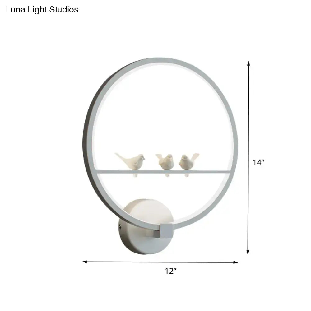 Modern led white bird circle wall lamp with sleek silver frame and three ceramic birds for bedroom lighting