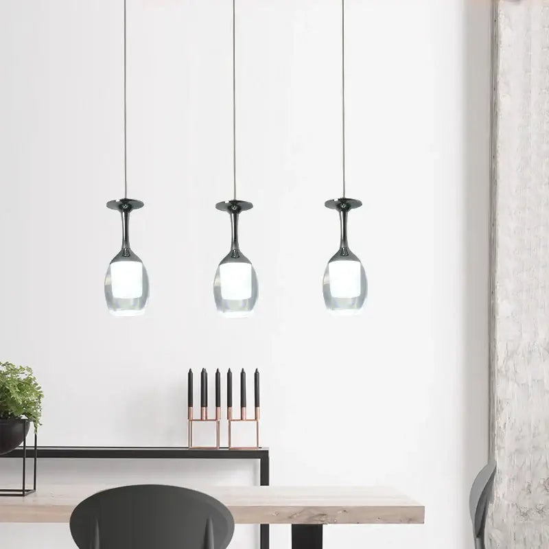 Three modern pendant lights with black metal stems and clear glass shades for dining room decorbites led wine glass chandelier