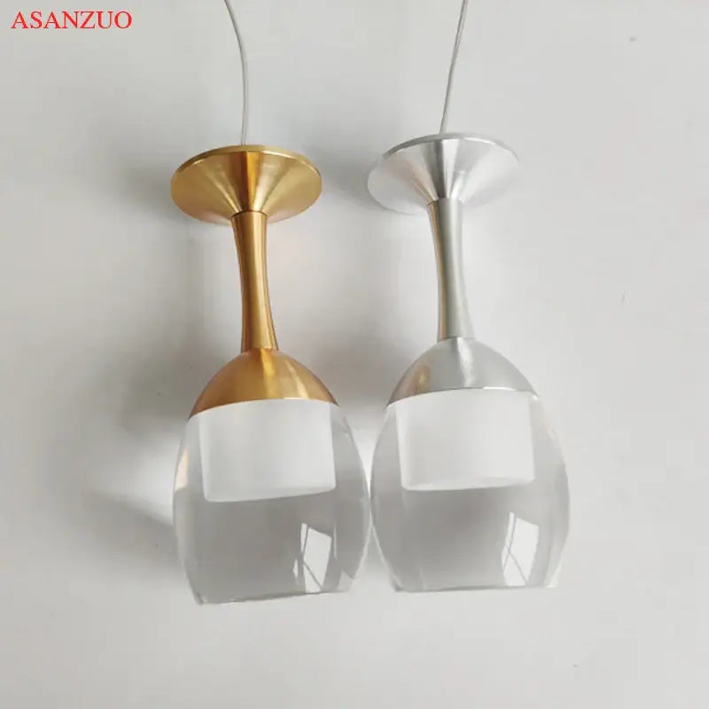 Modern led wine glass pendant lights featuring gold and silver metal stems with clear glass bowls for dining room decorbites led wine