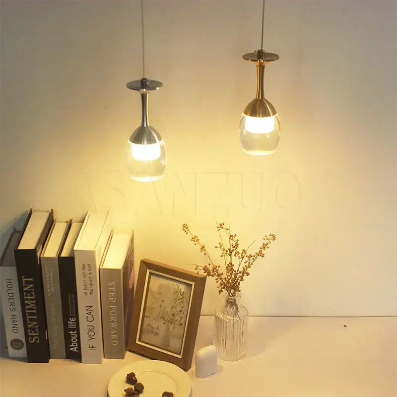 Two modern pendant lights with metallic stems and clear glass globes for dining room decorbites led wine chandelier