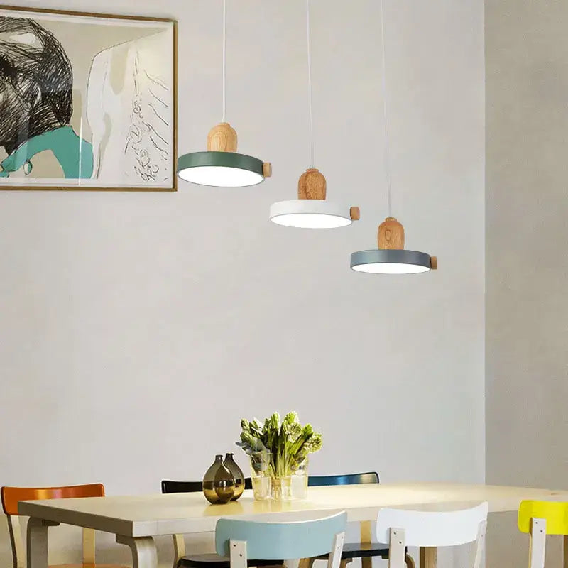 Three modern pendant lights with green white circular shades and wood accents decorbites led wood iron design