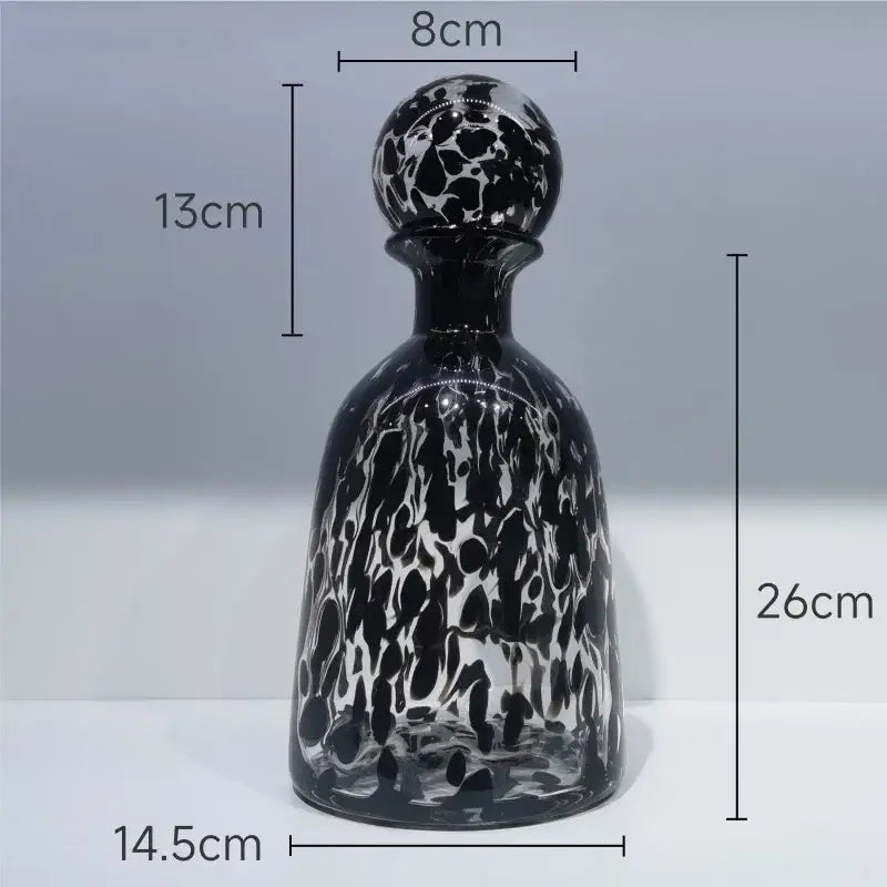 A sleek black and white marbled glass decanter with leopard texture stopper measuring 26cm tall for decorbites decor