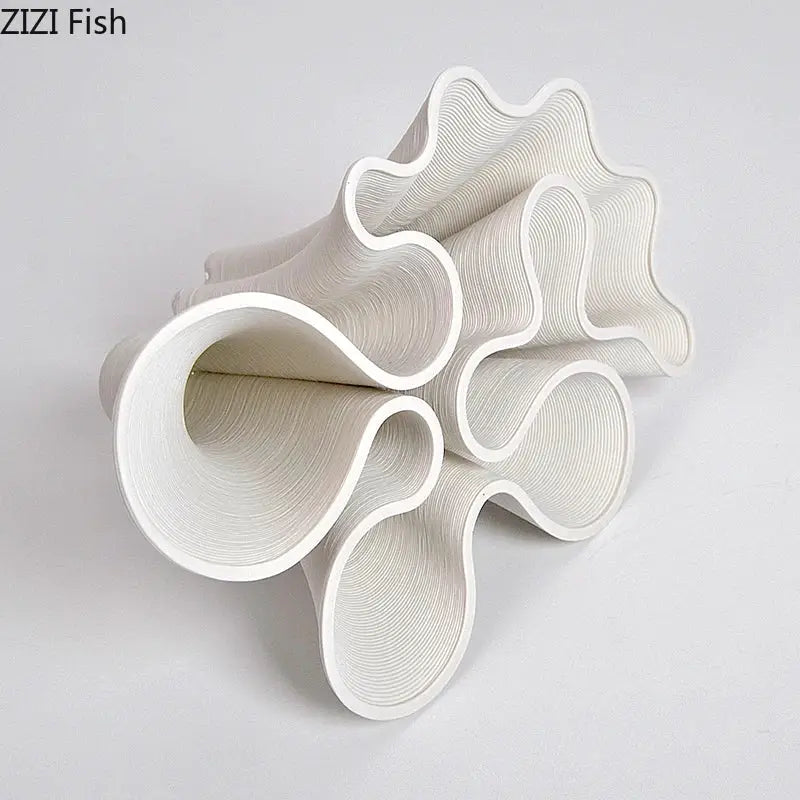 White sculptural ceramic vase with flowing wave like curves and concentric ridges for modern decorbites bud shape decor