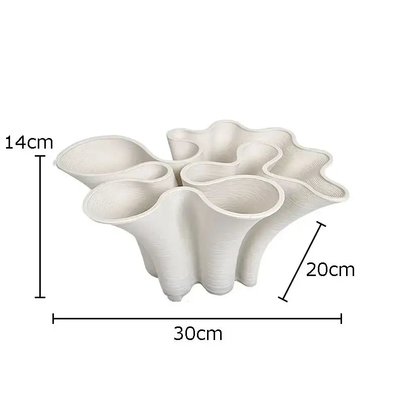 Cream-colored ceramic vase with sculpted coral design and multiple fluted openings for modern bud shape ceramic decorbites