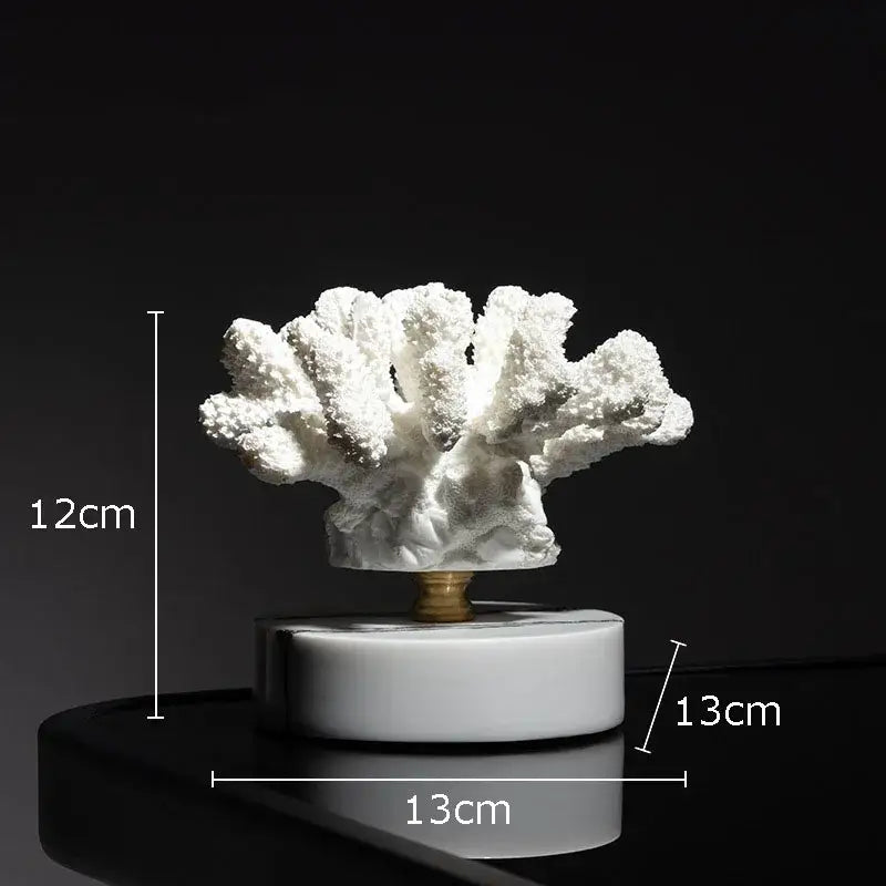 White coral resin statue with gold-toned central stem on white marble base for modern living room decoration