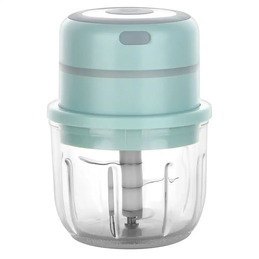 A compact mint green electric food chopper with a clear glass bowl and silver blade for kitchen garlic mashing